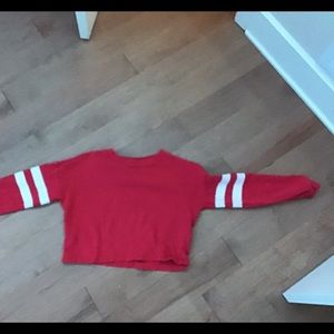 A pink long sleeve crop top